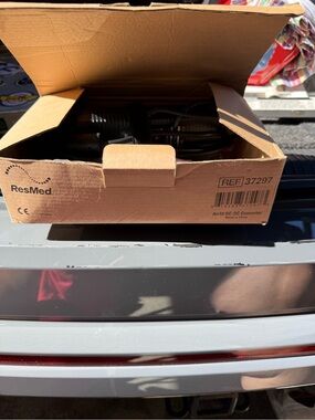 ResMed Air10 DC-DC Converter in Brown Cardboard Box with Black Cord